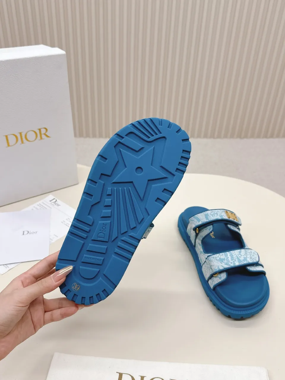 👟👟Ex-factory price 460👟👟 This black sheepskin DiorAct sandal is fashionable. Paired with an insole that fits the shape of your foot, it's made of exceptionally lightweight and comfortable leather. The upper straps feature a Velcro closure and feature a gold-finish metal "DIOR" logo. Can be matched with various styles to show modern style. Gold-finish metal "DIOR" logo Two adjustable Velcro straps Leather insole that fits the shape of your foot Soft and lightweight texture EVA sole decorated with Christian Dior's lucky star symbol Made in Italy Size 35--42 (Customized sizes 41 and 42 are non-refundable)